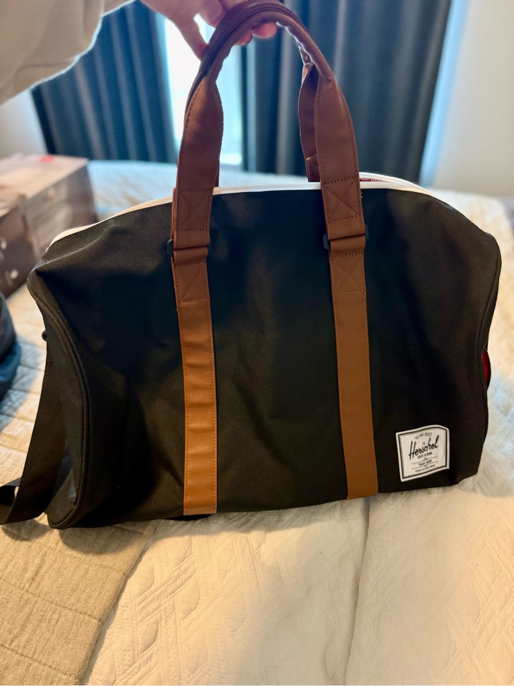 Herschel Supply Company Black Duffel with Brown Straps Striped Lining